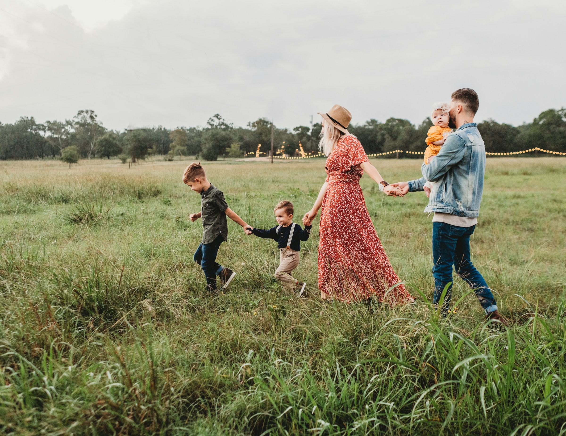 A family walks through a field in Alabama.